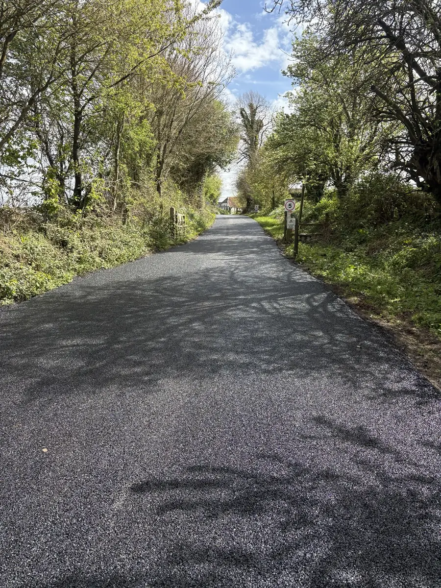 Completed machine-laid tarmac farm road in Hook, Hampshire