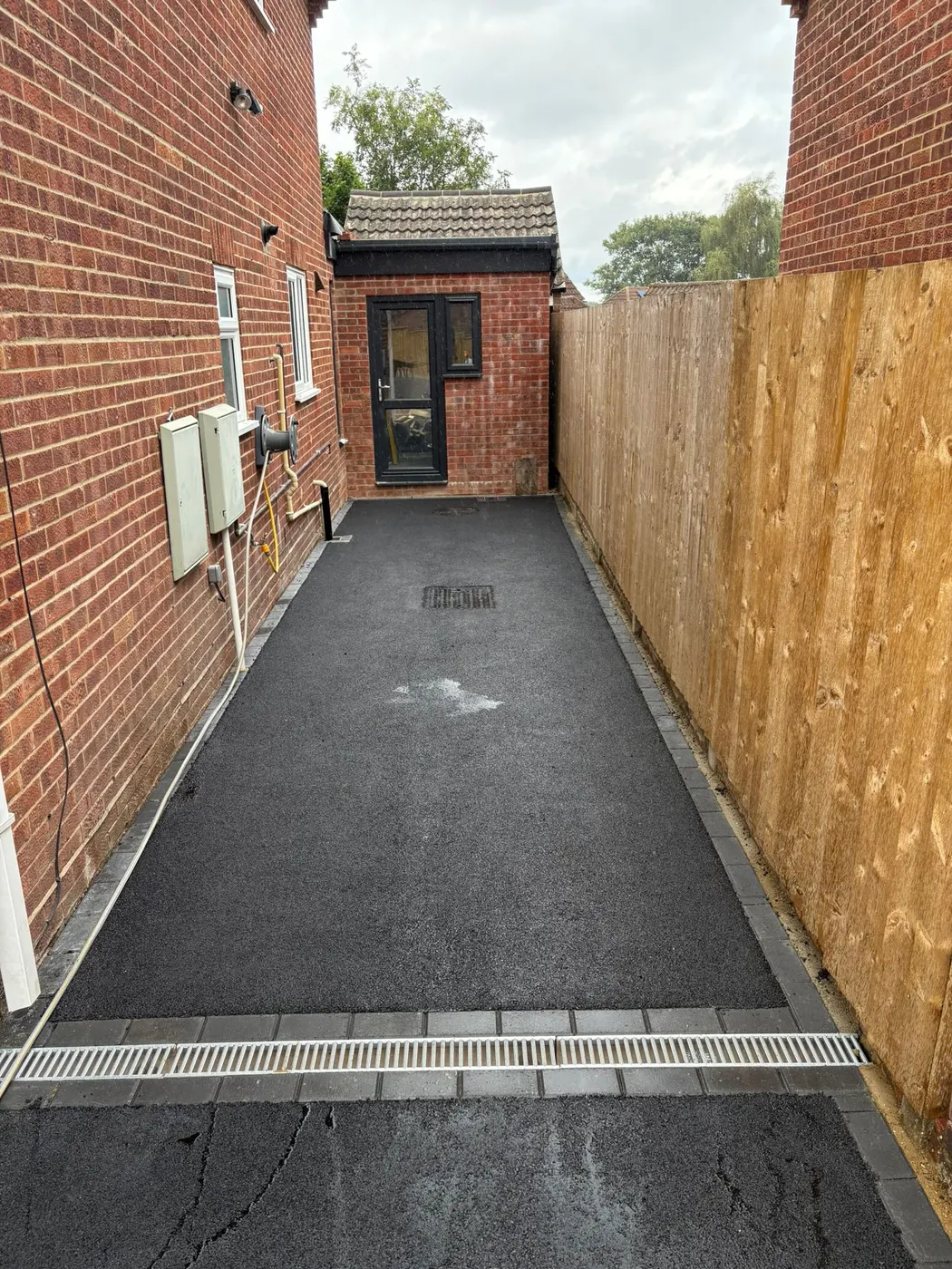 Tarmac driveway with block edging in Harefield